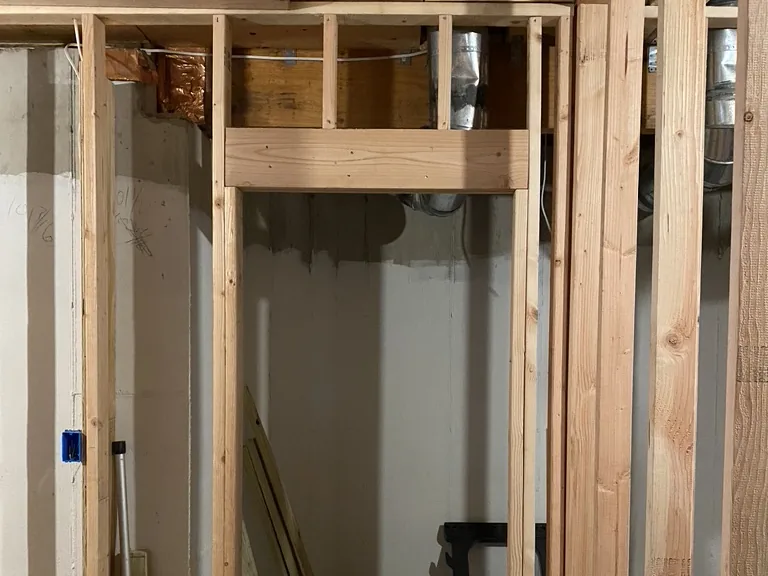 New timber framing for a doorway and partition wall in a basement